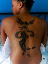 tribal phoenix pic tattoo on back